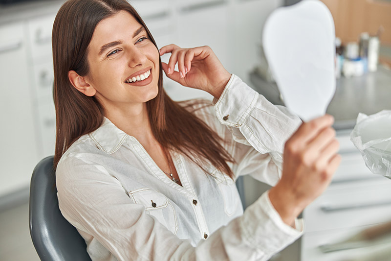 woman smiling during her visit to Southern Boulevard Dental Center