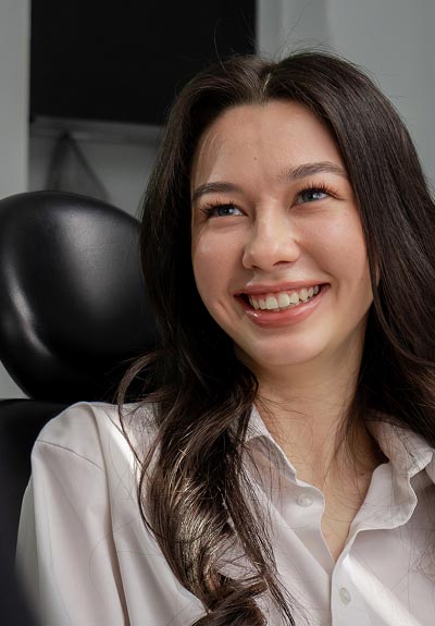 woman loving her smile thanks to Southern Boulevard Dental Center